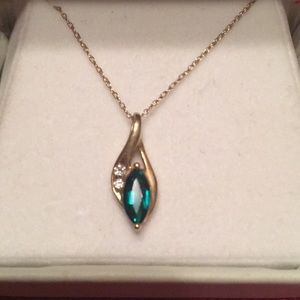 Emerald and diamonds pendant on gold necklace